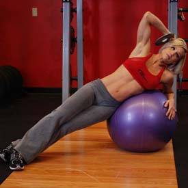 Oblique crunch on ball with medicine ball