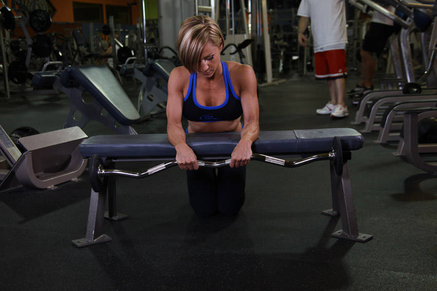 Palms Down Dumbbell Wrist Curl Over A Bench Exercise Guide And Video